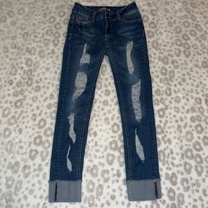 Ripped blue jeans size 5 fits more like a 3